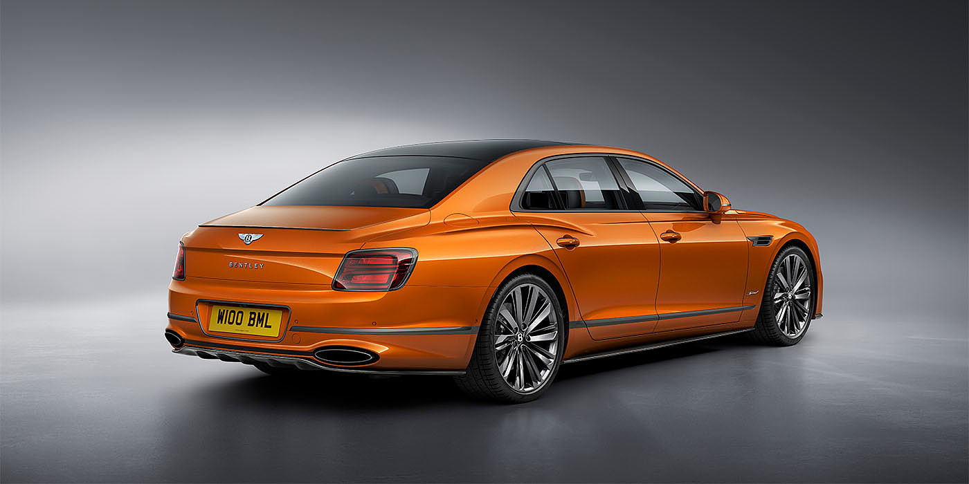 Bentley Hong Kong - Kam Lung Bentley Flying Spur Speed in Orange Flame colour rear view, featuring Bentley insignia and enhanced exhaust muffler.
