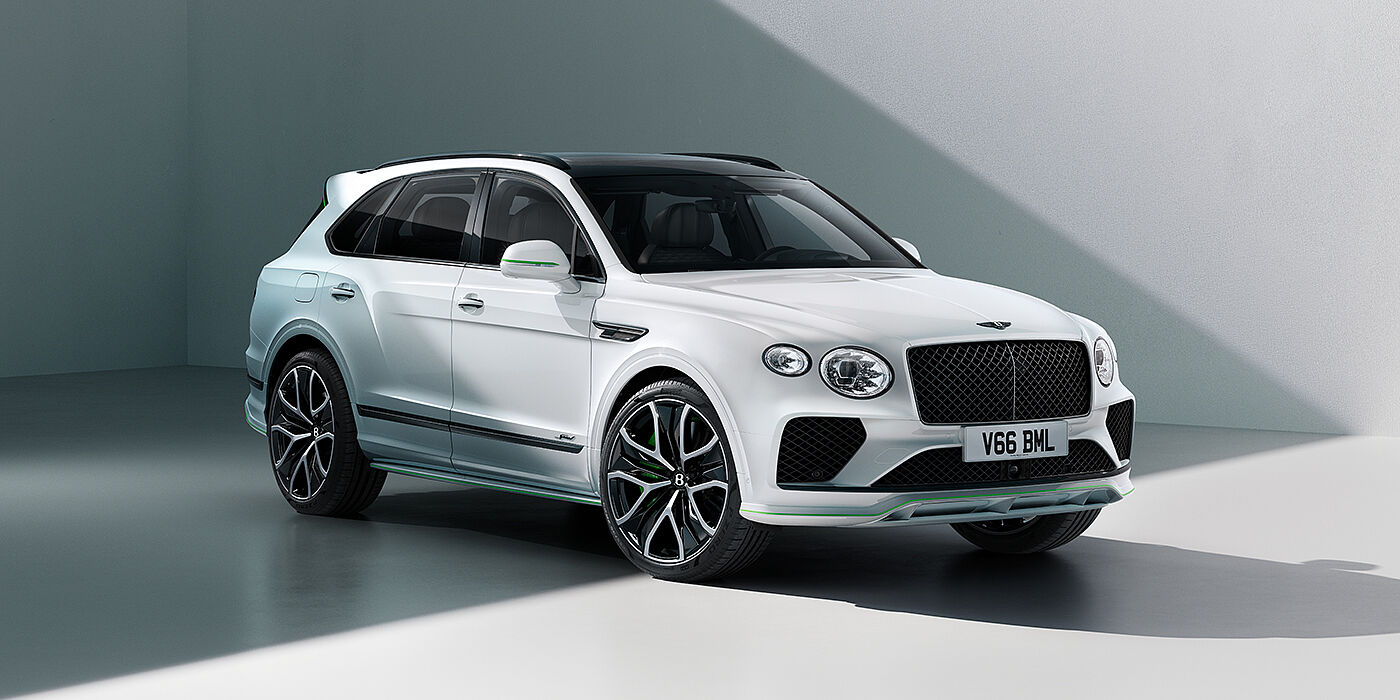Bentley Hong Kong - Kam Lung Bentley Bentayga Speed SUV front three quarter in Snow Quartz Pearlescent by Mulliner white paint against a grey wall