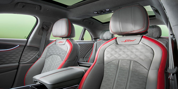 Bentley Hong Kong - Kam Lung Bentley Flying Spur Speed sedan interior showing front and rear seats in Hotspur red and Gravity Grey hides, with Speed seat emblems